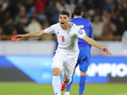 مهدي طارمي مهاجم إيران يحتفل بهدفه الثاني في مرمى أوزبكستان - 25 مارس 2025 - https://www.the-afc.com/