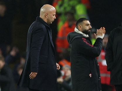 محمد صلاح وآرني سلوت بعد تعادل ليفربول مع ليدز يونايتد في الدوري الإنجليزي الممتاز - 6 ديسمبر 2025 - Action Images via Reuters