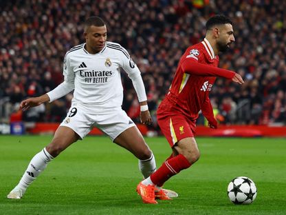 محمد صلاح وكيليان مبابي نجما ليفربول وريال مدريد خلال مواجهتهما بدوري أبطال أوروبا - 27 نوفمبر 2024 - Reuters