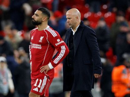 أرني سلوت ومحمد صلاح بعد لقاء ليفربول وإيندهوفن بدوري أبطال أوروبا - 26 نوفمبر 2025 - Reuters