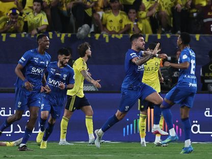 فرحة لاعبي الهلال بهدف التعادل أمام النصر في دوري روشن السعودي - 12 مايو 2026 - Reuters