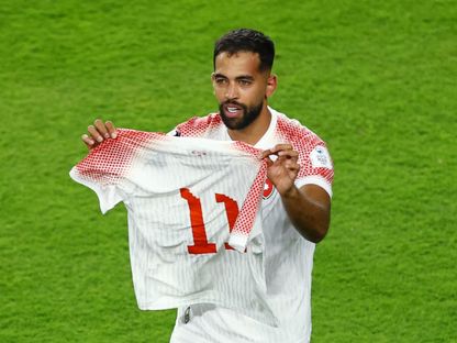 علي علوان مهاجم الأردن يحتفل بعد تسجيله أول هدف لبلاده في كأس العالم ضد النمسا حاملا القميص رقم 11 الخاص بزميله يزن النعيمات - 17 يونيو 2026 - Reuters