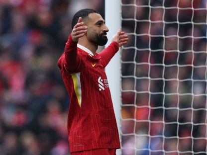 محمد صلاح مهاجم ليفربول يحتفل بالتسجيل أمام ولفرهامبتون - 16 فبراير 2025 - Reuters