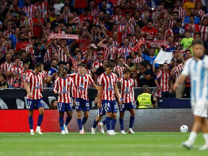 لاعبي أتلتيكو مدريد يحتفلون بهدف لي كانغ إن ضد مالاغا بالدوري الإسباني - 19 أغسطس 2026 - Reuters