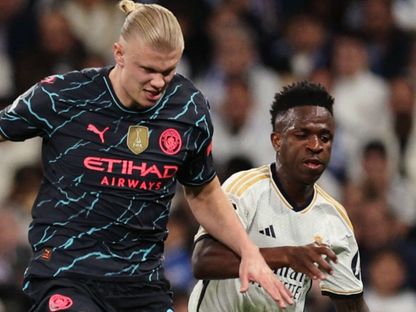 فينيسيوس جونيور وإيرلينغ هالاند في مباراة ريال مدريد ومانشستر سيتي بملحق ثمن نهائي دوري أبطال أوروبا 2025 - Reuters