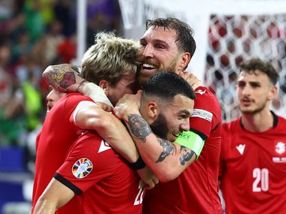 لاعبو جورجيا يحتفلون بعد الفوز على البرتغال والتأهل لدور الـ16 في بطولة أوروبا "يورو 2024" - REUTERS