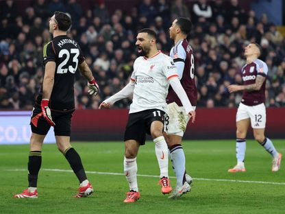 محمد صلاح مهاجم ليفربول يحتفل بعد تسجيله هدفاً في شباك أستون فيلا - 19 فبراير 2025 - REUTERS