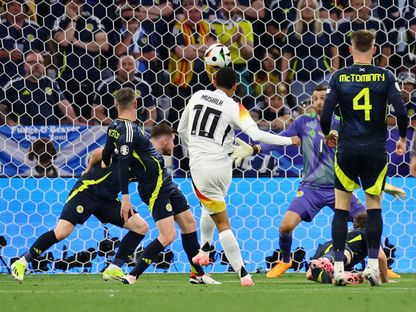 جمال موسيالا يسدد الكرة في شباك اسكتلندا محرزاً الهدف الثاني لألمانيا في مباراة افتتاح يورو 2024 - 14 يونيو 2024 - REUTERS