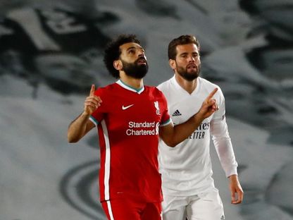 محمد صلاح مهاجم ليفربول يحتفل بهدفه أمام ريال مدريد في ربع نهائي دوري أبطال أوروبا - 6 أبريل 2021 - Reuters