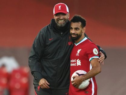 مدرب ليفربول يورغن كلوب ومحمد صلاح بعد تسجيله "هاتريك" أمام ليدز يونايتد - 12 سبتمبر 2020 - Pool via REUTERS