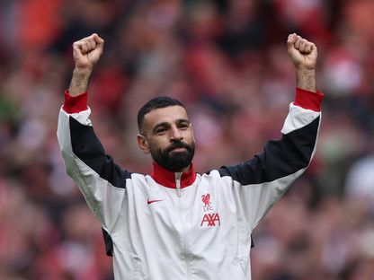 محمد صلاح يحتفل بفوز ليفربول على وست هام في الدوري الإنجليزي - 13 أبريل 2025 - Reuters
