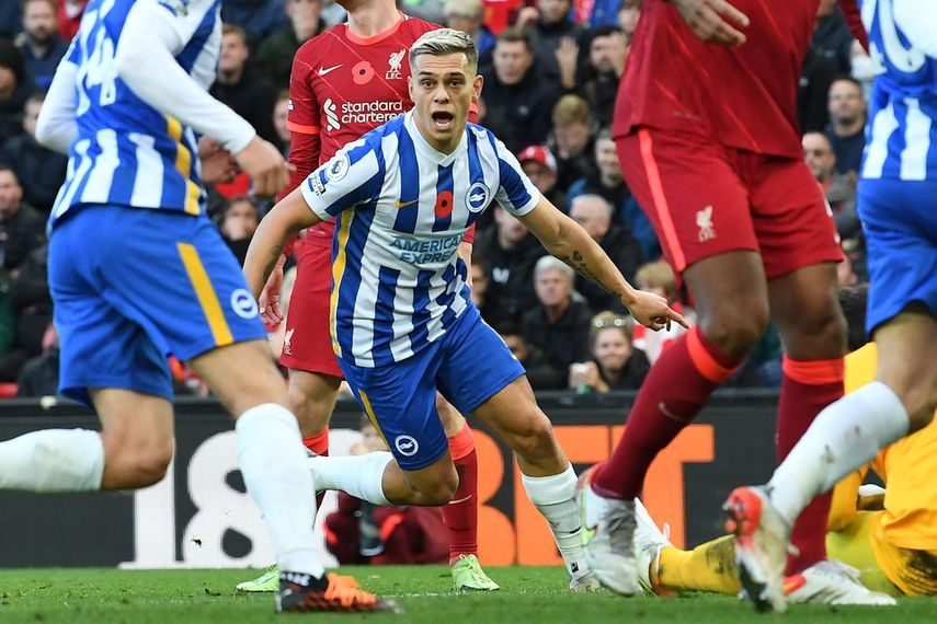 Brighton's Belgian midfielder Leandro Trossard (C) celebrates after scoring their second goal during the English Premier League football match between Liverpool and Brighton and Hove Albion at Anfield in Liverpool, north west England on October 30, 2021. (Photo by Paul ELLIS / AFP) / RESTRICTED TO EDITORIAL USE. No use with unauthorized audio, video, data, fixture lists, club/league logos or 'live' services. Online in-match use limited to 120 images. An additional 40 images may be used in extra time. No video emulation. Social media in-match use limited to 120 images. An additional 40 images may be used in extra time. No use in betting publications, games or single club/league/player publications. /  - AFP