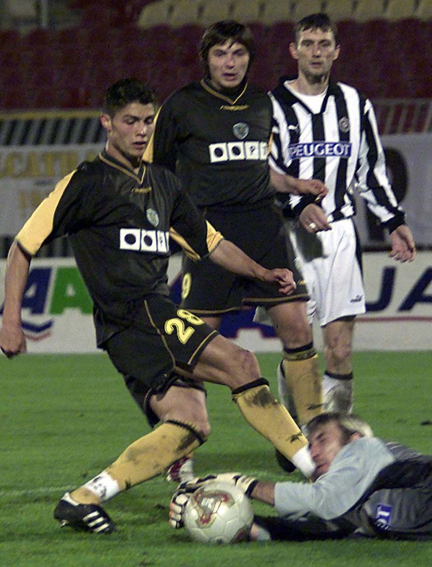 ILIC OF PARTIZAN SAVES THE BALL IN FRONT OF CRISTIANO RONALDO OF
SPORTING LISBON DURING UEFA CUP ... - REUTERS